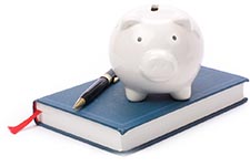 piggy bank standing on book